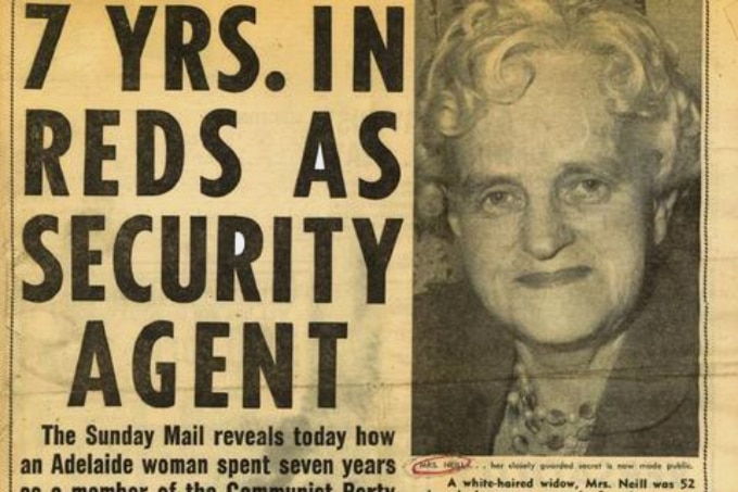 Newspaper clipping with image of smiling Anne Neill and headline, '7 YRS. IN REDS AS SECURITY AGENT'.