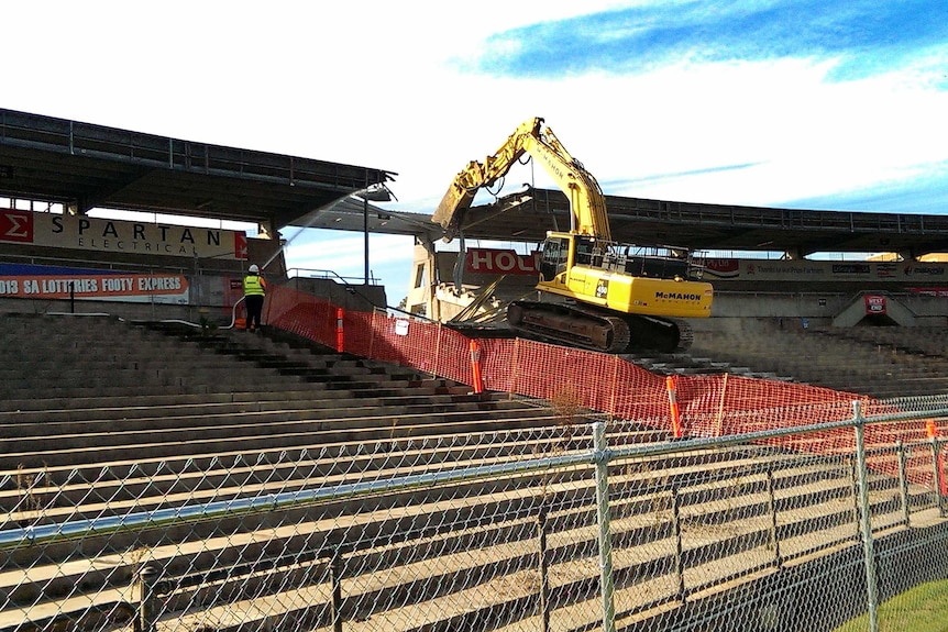 Machinery tearing at the grandstands