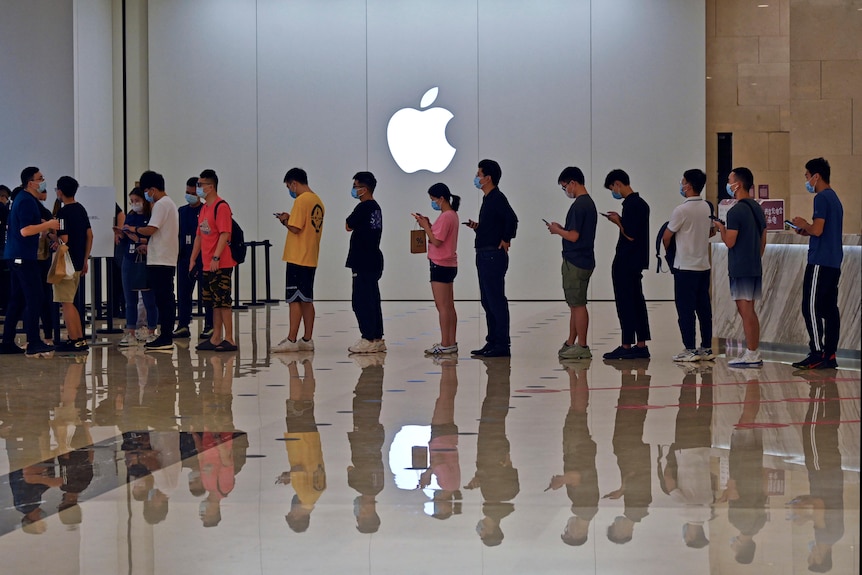 People line up at an Apple store in China. 