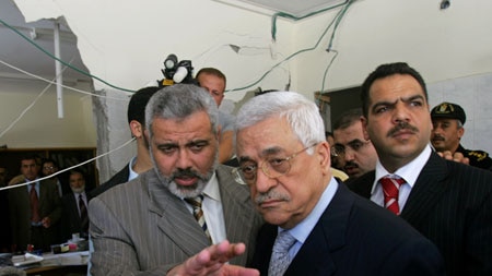 Palestinian PM Ismail Haniyeh and President Mahmoud Abbas inspect the damage to his office.