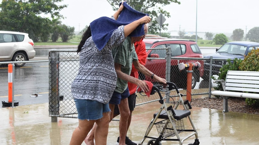 People arrive at a shelter in Bowen ahead of the cyclone.