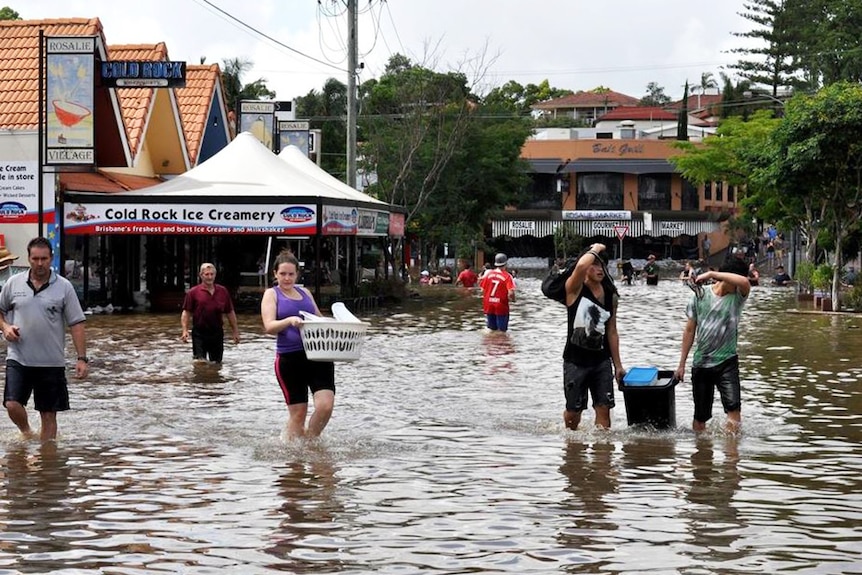 Business owners salvaged what they could after floodwaters swamped Rosalie village in inner Brisbane