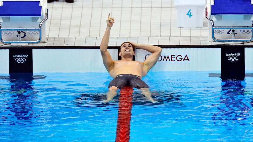 Cameron van der Burgh relaxes after setting a world record to win the men's 100m breaststroke final.