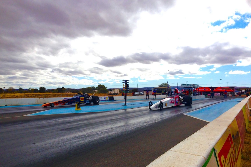 Cars wait at the starting line at the Alice Springs drag races