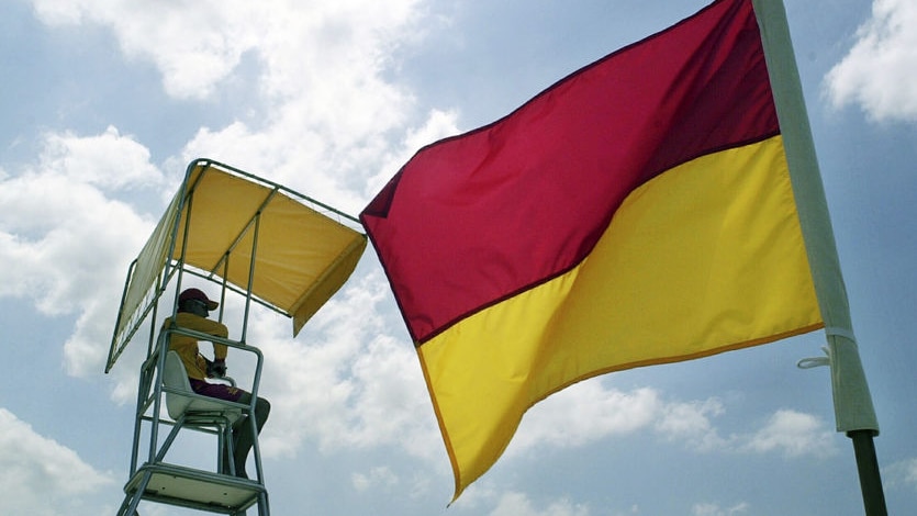 A surf lifesaver keeps watch