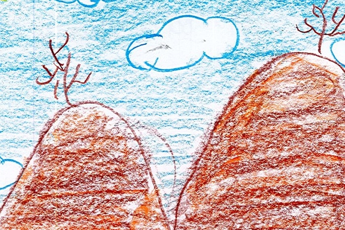 A child's drawing of red hills with a tree on top of each, blue sky, white clouds, yellow sun