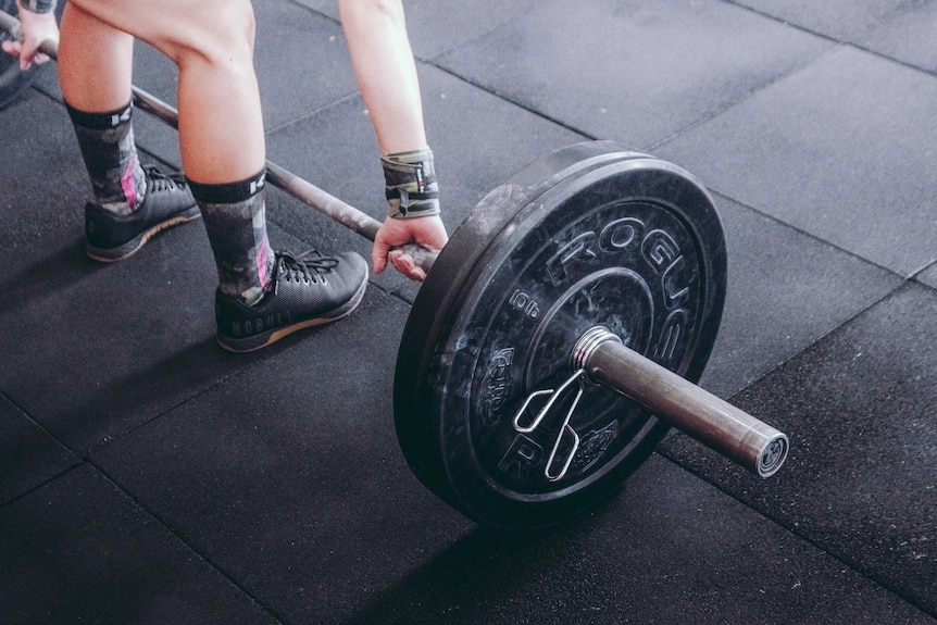 A weightlifter readies to workout.