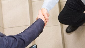 Two people shaking hands (Thinkstock: Hemera)