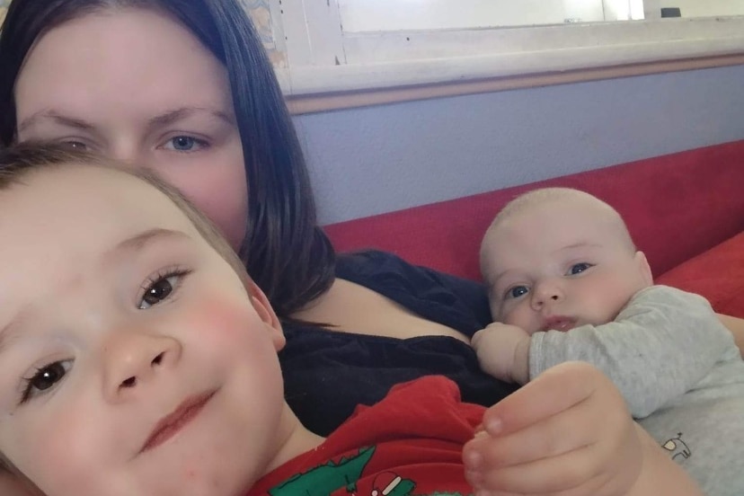 Mum and two sons on a couch in a close-up selfie photo