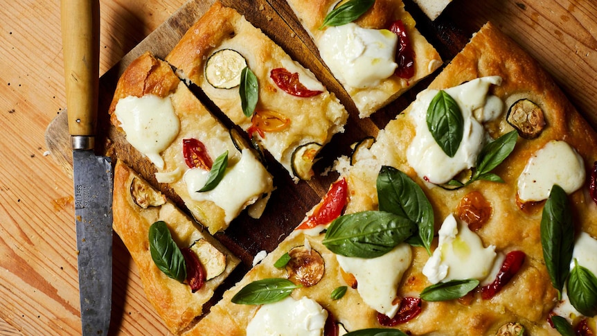 Cooked zucchini and cherry tomato focaccia, a recipe by Julia Busuttil Nishimura.