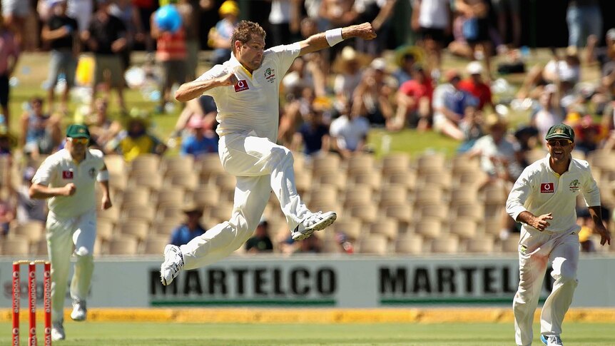 Australia's Ryan Harris celebrates the wicket of Rahul Dravid against India in Adelaide in 2012.