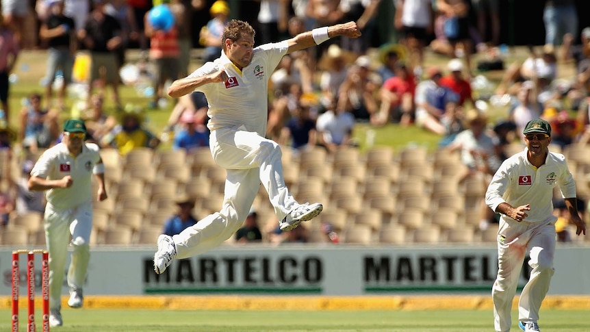 Australia's Ryan Harris celebrates the wicket of Rahul Dravid against India in Adelaide in 2012.