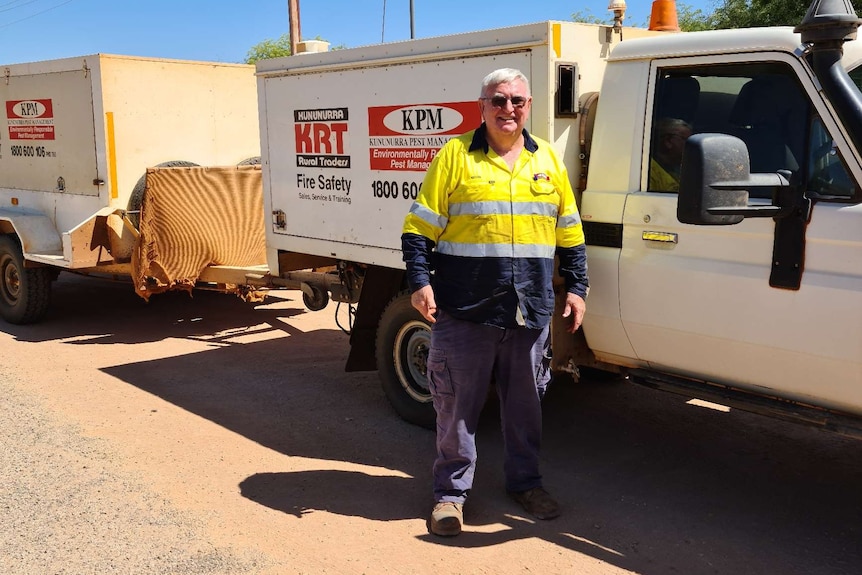 Kevin Williams standing in front of his work vehicle.