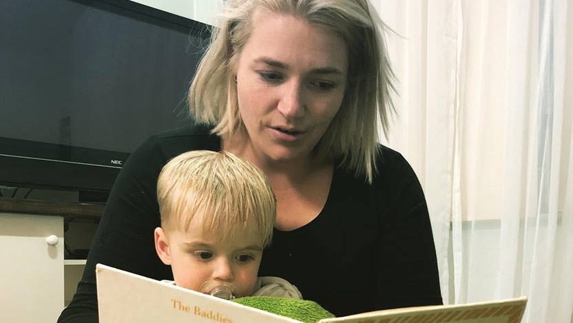 Alicia Edwards reads to her son Flynn