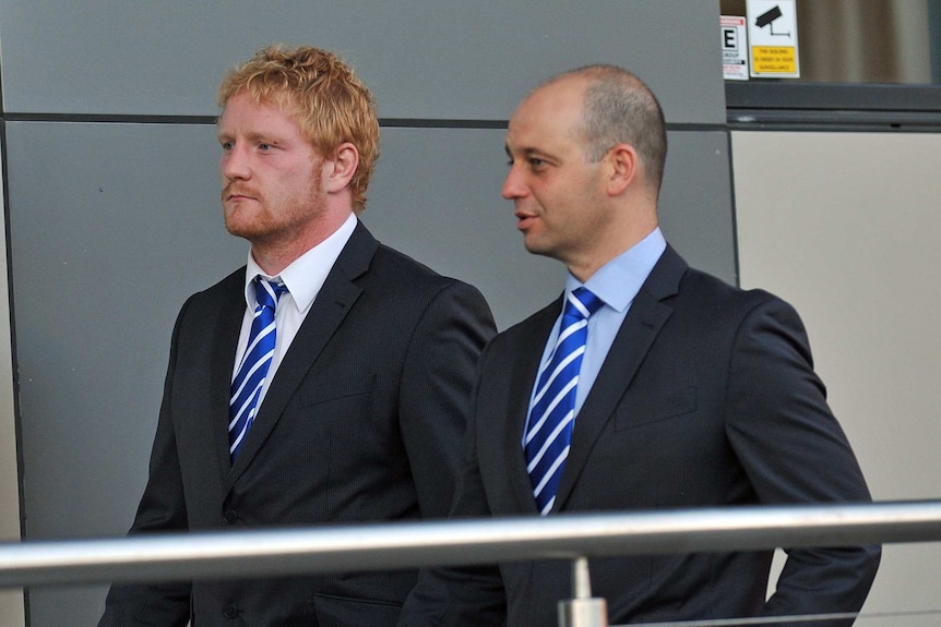 Canterbury Bulldogs prop James Graham (left) and club CEO Todd Greenberg arrive at an NRL judiciary hearing October 4, 2012.
