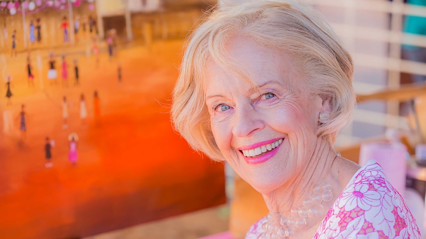 Dame Quentin Bryce smiles at the camera, dressed in pink.