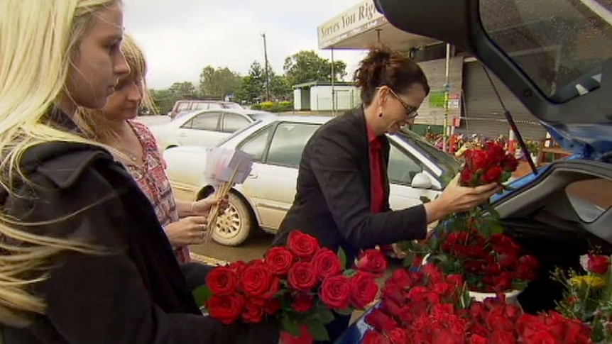 Tully residents delivered roses to residents of Ravenshoe as a sign of support