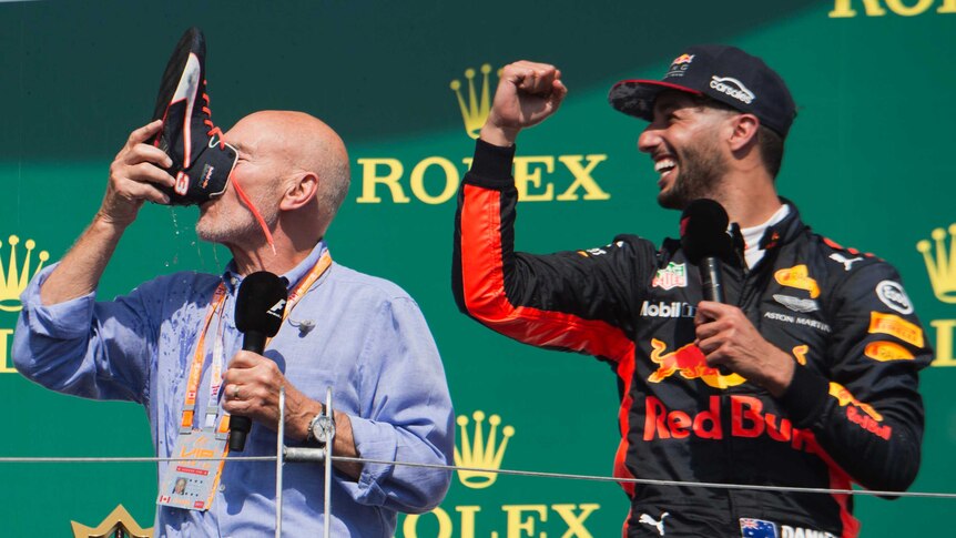Patrick Stewart does a shoey with Daniel Ricciardo on the podium of the Canadian Grand Prix.