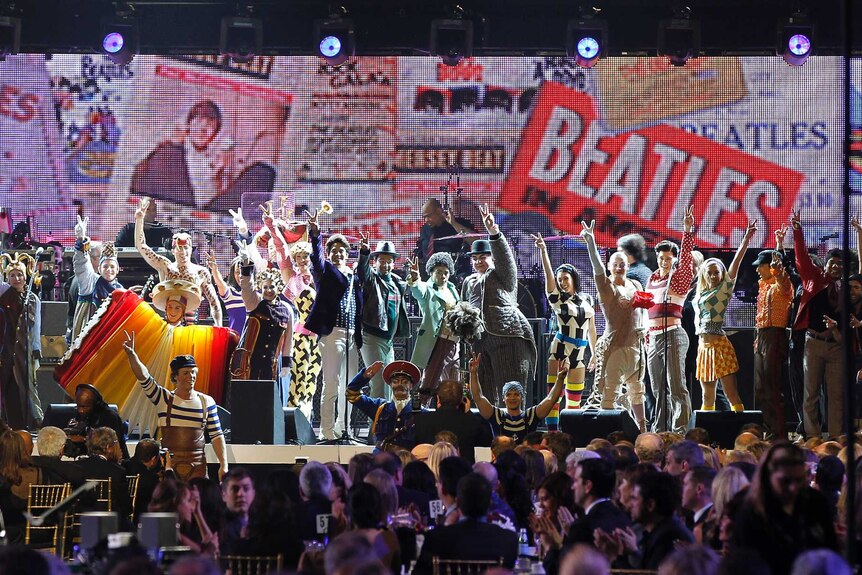 Members of the Cirque du Soleil show, "Love", perform during the 2012 MusiCares Person of the Year.