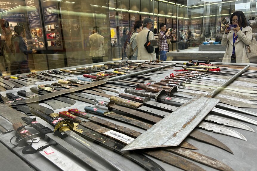 swords in a museum display case 