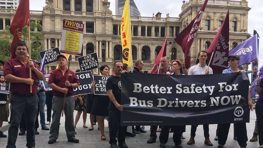 Bus drivers and union representatives rally over driver safety in Brisbane.