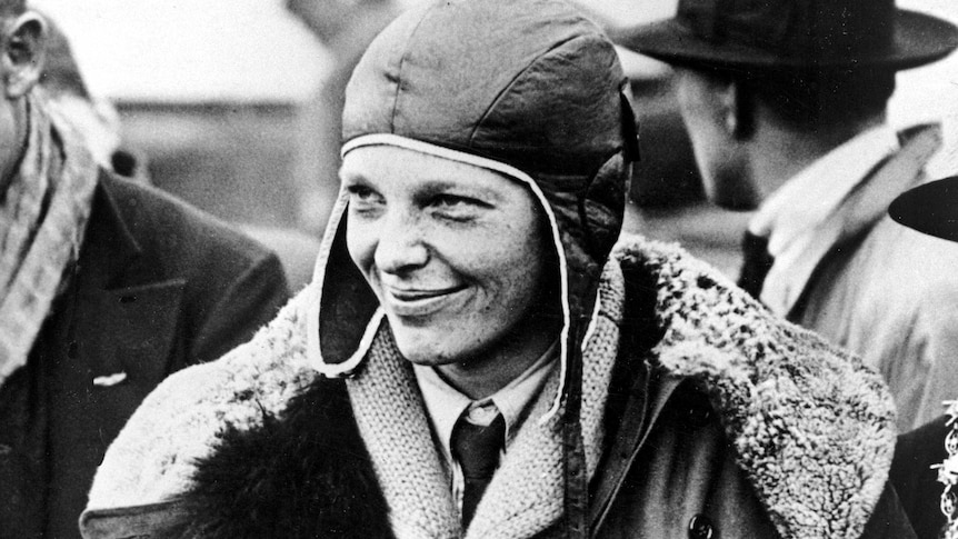 American aviatrix Amelia Earhart poses with flowers as she arrives in Southampton.