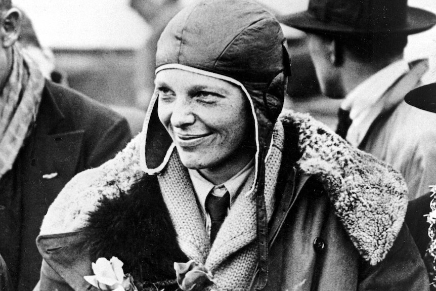 American aviatrix Amelia Earhart poses with flowers as she arrives in Southampton.