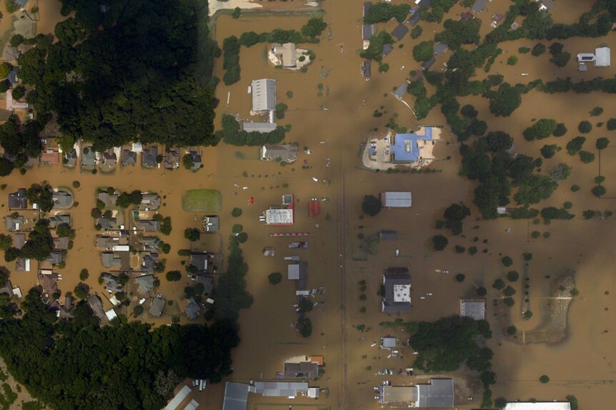 Satellite magery shows homes and businesses flooded near Baton Rouge, Louisiana.