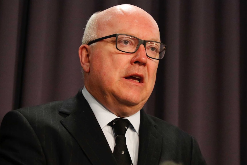 Attorney-General George Brandis speaks at a press conference.