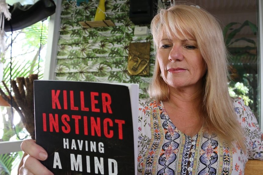 Sonia Anderson with a copy the controversial Killer Instinct book