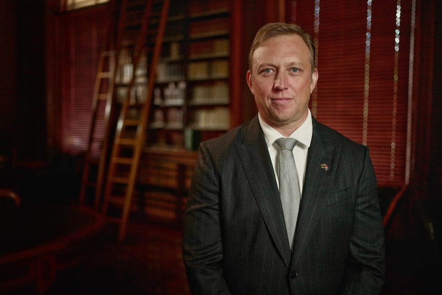 Premier Steven Miles wears a suit and tie