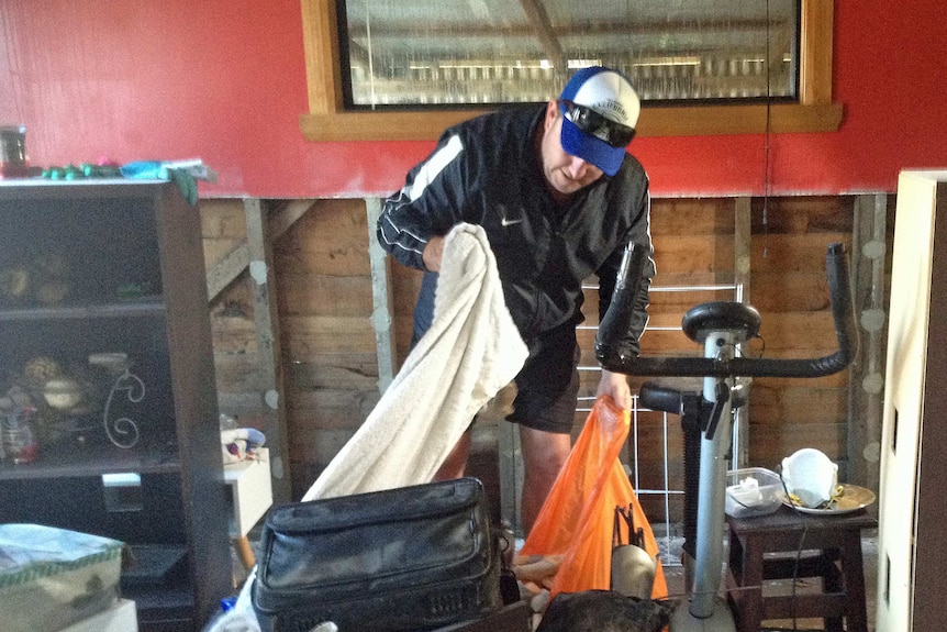 Latrobe homeowner Craig Sutton sorting through flood damaged possessions June 2016