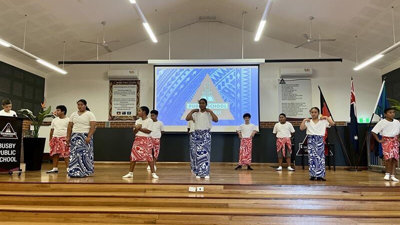 Students at Busby School perform a pacific island dance. 