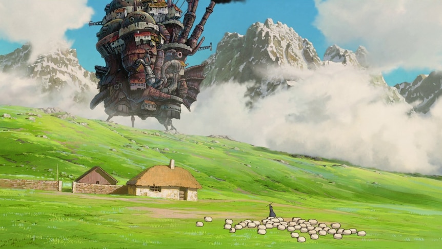 A still from the Miyazaki animation Howl's Moving Castle, with the castle in the background of a wide green pasture.