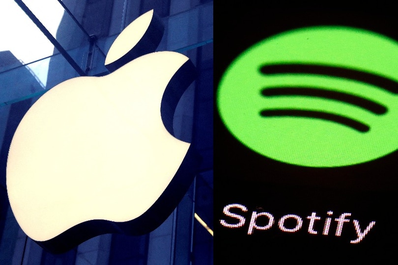 A composite of two images: Apple's logo on a glass wall, and Spotify's logo shown on a screen