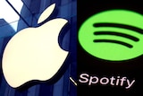 A composite of two images: Apple's logo on a glass wall, and Spotify's logo shown on a screen