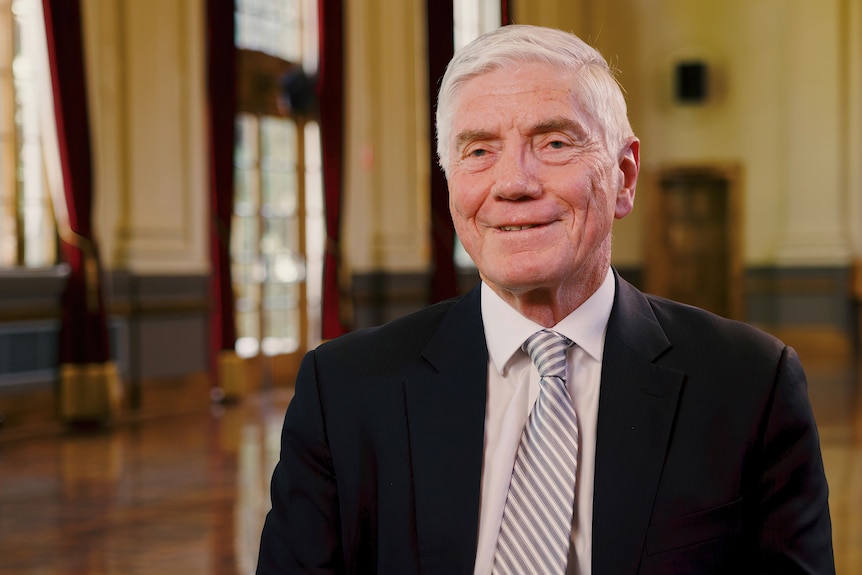 A man wearing a suit and tie.