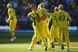 Mitchell Starc celebrates the wicket of Luke Ronchi