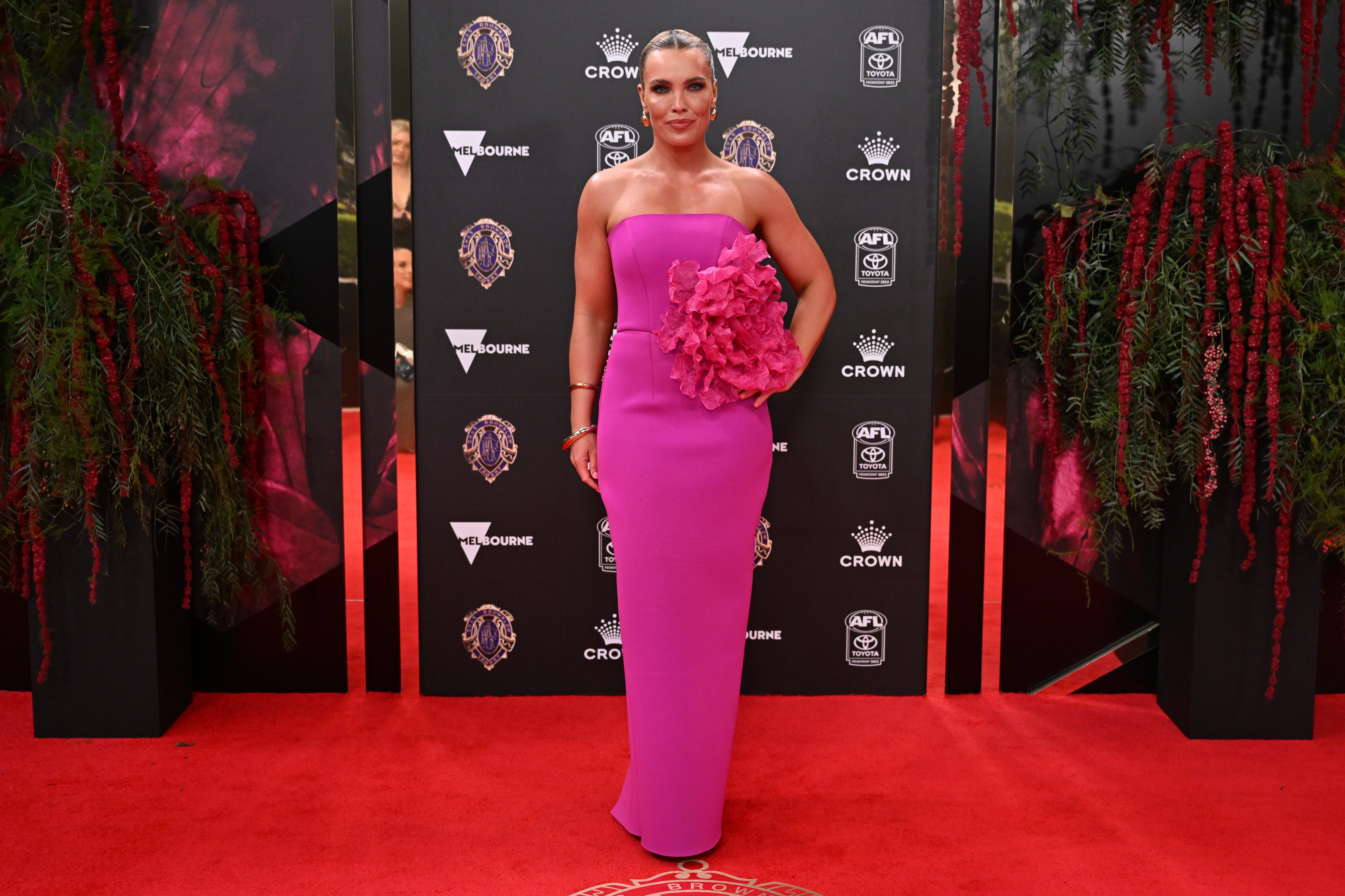 AFLW player Abbey Holmes stands out in highlighter pink.