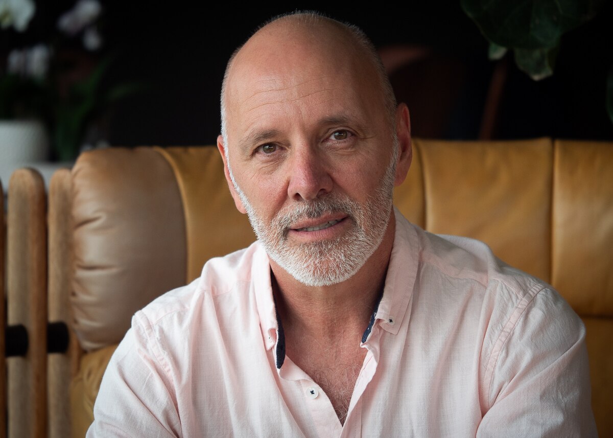 A man wearing a pink shirt.