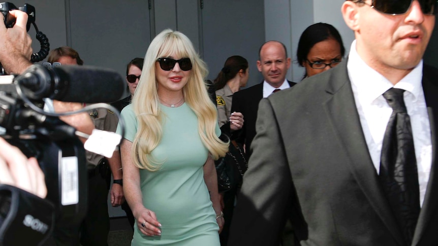 Lindsay Lohan leaves court after a progress report hearing on her probation