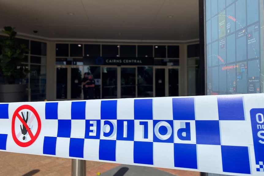 Police tape in front of the entrance to Cairns Central shopping centre