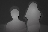 A greyscale image of the silhouette of a man and a woman.