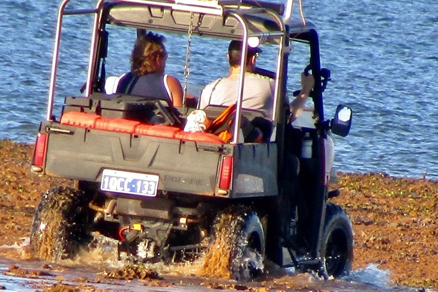 an amphibious vehicle with 2 men