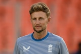 Joe Root has a neutral expression