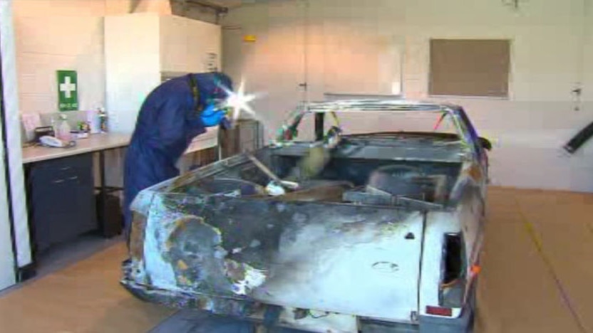 Police examine burnt out vehicle belonging to Greenmount murder victim Stefan Borsa.