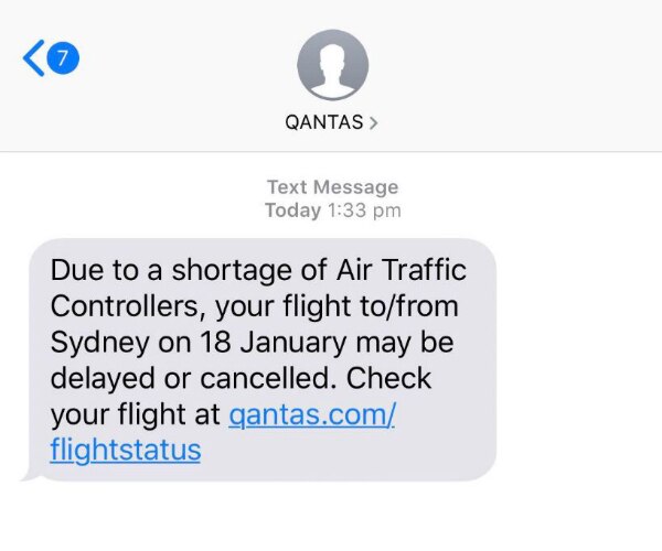 A text message from Qantas to customers informing them of delays due to a shortage of air traffic controllers.