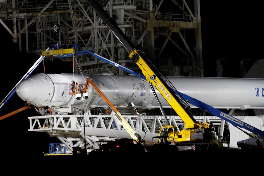 A SpaceX Falcon 9 rocket is prepared for another launch attempt.