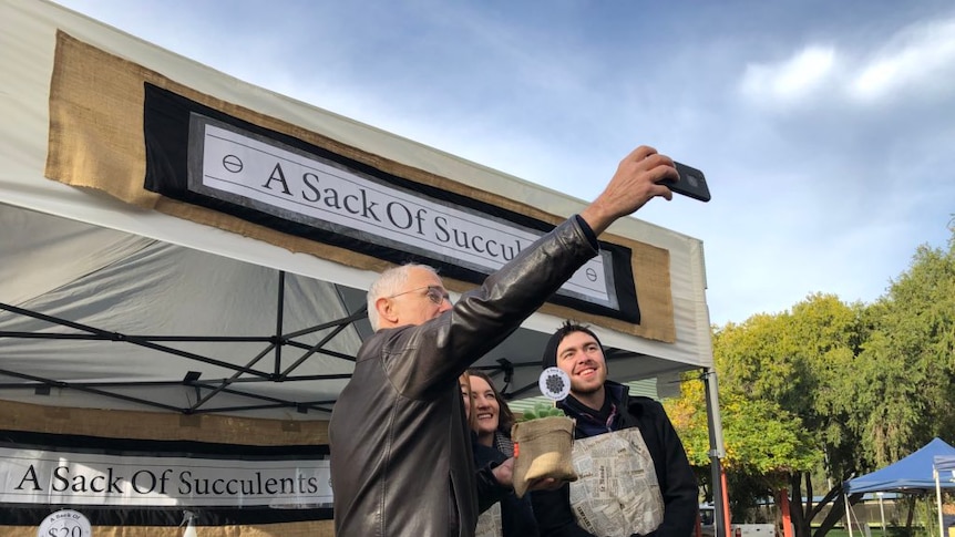 Malcolm Turnbull takes a selfie with Liberal candidate for Mayo Georgina Downer.