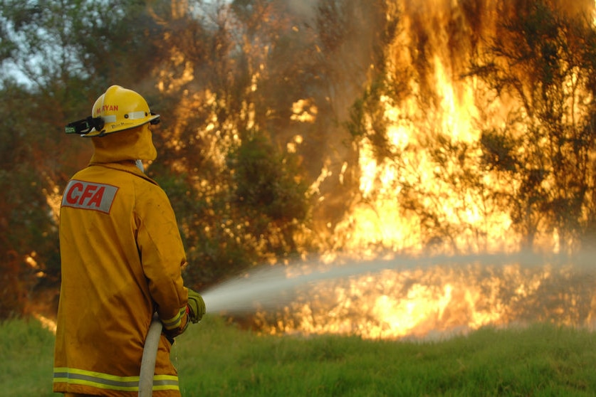 A fireman fights a blaze in Boolarra South in Gippsland